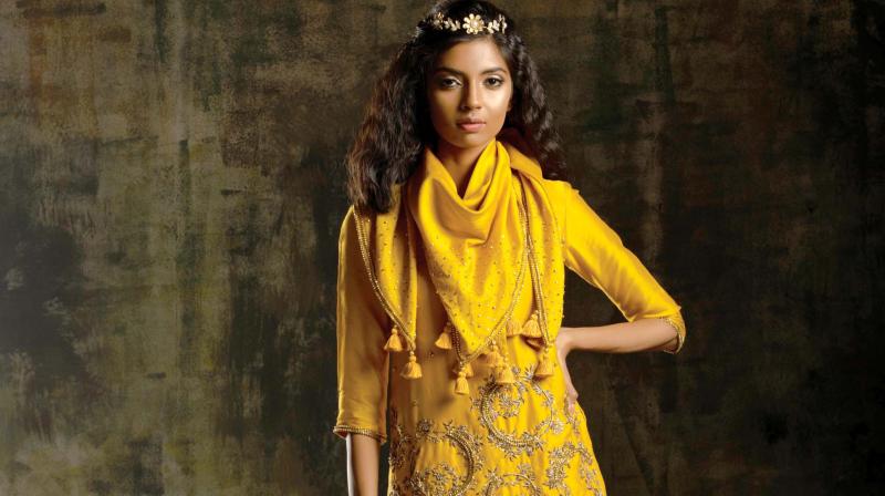 A model sporting a dhoti Skirt by designers Mona & Vishu A model sporting a dhoti Skirt by designers Mona & Vishu
