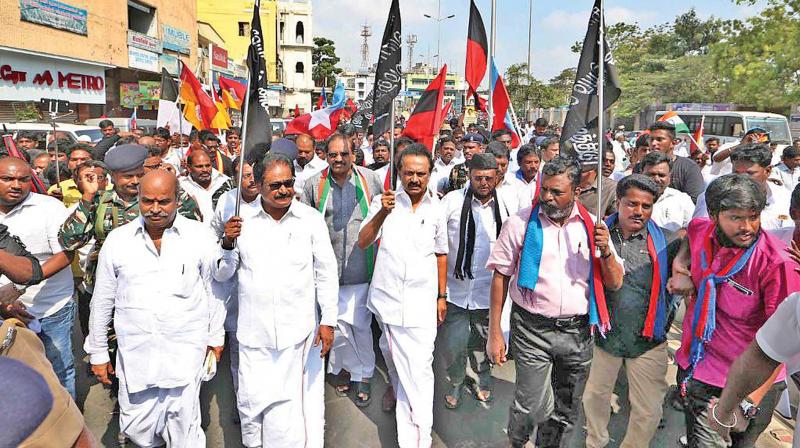 DMK members led by their leader M K Stalin stage protest against delay in the formation of Cauvery Management Board at Anna Salai on Thursday. DMK members led by their leader M K Stalin stage protest against delay in the formation of Cauvery Management Board at Anna Salai on Thursday.