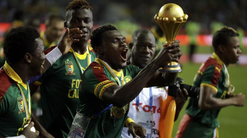 Cameroon players celebrate with the trophy after the match. (Photo: AP) Cameroon players celebrate with the trophy after the match. (Photo: AP)