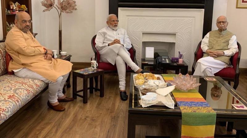 Prime Minister Narendra Modi and BJP president Amit Shah on Friday visited veteran leaders LK Advani and Murli Manohar Joshi to seek their blessings after the BJP-led NDA won a second term with a resounding majority. (Photo: Twitter/ @narendramodi) Prime Minister Narendra Modi and BJP president Amit Shah on Friday visited veteran leaders LK Advani and Murli Manohar Joshi to seek their blessings after the BJP-led NDA won a second term with a resounding majority. (Photo: Twitter/ @narendramodi)