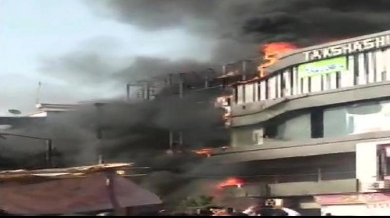 A massive fire engulfed a multi-storey building, housing a coaching centre, located in the Sarthana area here and claimed as many as 20 lives, including that of several students. (Photo: File) A massive fire engulfed a multi-storey building, housing a coaching centre, located in the Sarthana area here and claimed as many as 20 lives, including that of several students. (Photo: File)