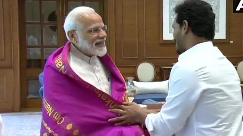 YSR Congress Party president and Andhra Pradesh Chief Minister-designate Y S Jagan Mohan Reddy met Prime Minister Narendra Modi. (Photo: Twitter/ ANI) YSR Congress Party president and Andhra Pradesh Chief Minister-designate Y S Jagan Mohan Reddy met Prime Minister Narendra Modi. (Photo: Twitter/ ANI)