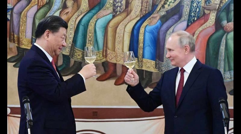 Russian President Vladimir Putin and Chinas President Xi Jinping make a toast during a reception following their talks at the Kremlin in Moscow on March 21, 2023.  (Photo: AFP)