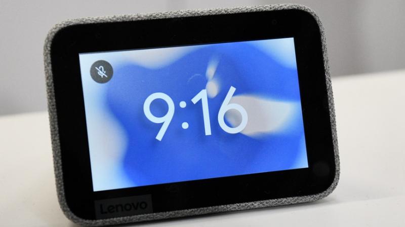 The clock features a small 4-inch touchscreen display, fabric-covered 6-watt speaker, volume buttons, and USB port to charge your phone. The clock features a small 4-inch touchscreen display, fabric-covered 6-watt speaker, volume buttons, and USB port to charge your phone.