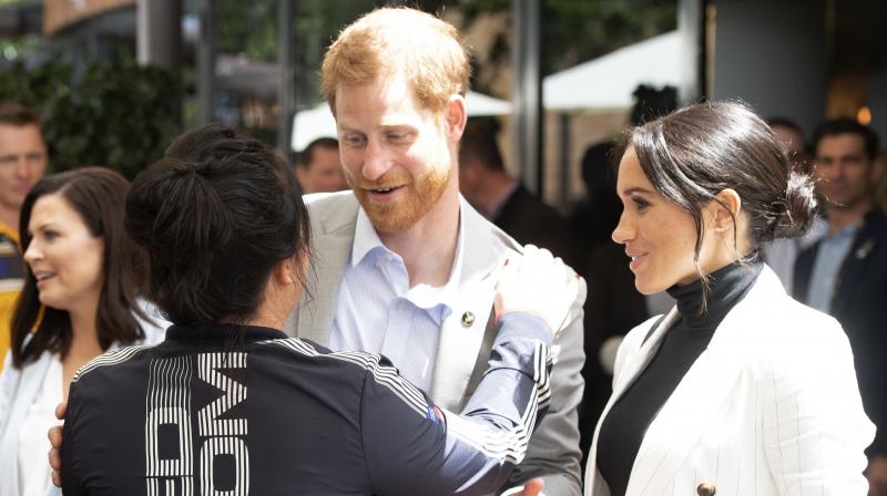 Meghan, Duchess of Sussex, watches her husband Britain's Prince Harry speaks during a lunchtime reception hosted by Australian Prime Minister Scott Morrison with Invictus Games competitors, their families and friends in Sydney Sunday, Oct. 21, 2018. (Photo: AP) Meghan, Duchess of Sussex, watches her husband Britain's Prince Harry speaks during a lunchtime reception hosted by Australian Prime Minister Scott Morrison with Invictus Games competitors, their families and friends in Sydney Sunday, Oct. 21, 2018. (Photo: AP)