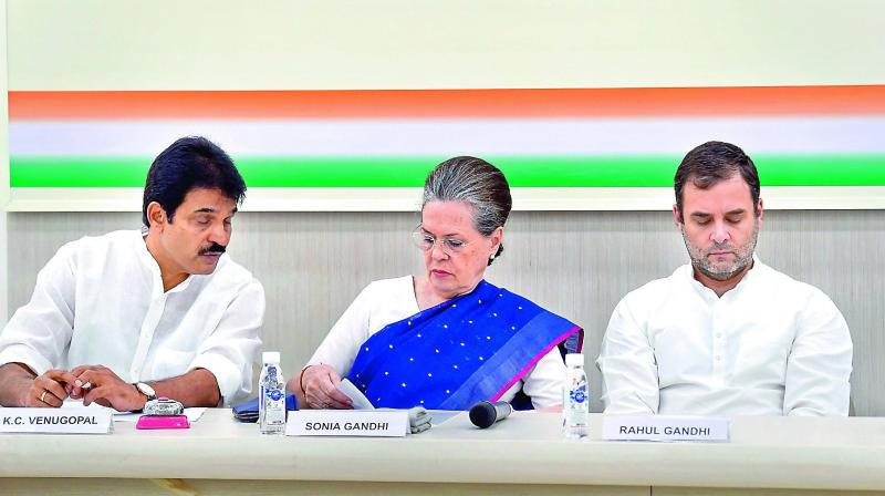 Former Congress President Rahul Gandhi with Sonia Gandhi and K.C. Venugopal during Congress Working Committee meeting in New Delhi on Saturday. (PTI) Former Congress President Rahul Gandhi with Sonia Gandhi and K.C. Venugopal during Congress Working Committee meeting in New Delhi on Saturday. (PTI)