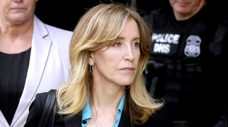 Felicity Huffman arrives at federal court in Boston to face charges in a nationwide college admissions bribery scandal. (Photo: AP) Felicity Huffman arrives at federal court in Boston to face charges in a nationwide college admissions bribery scandal. (Photo: AP)