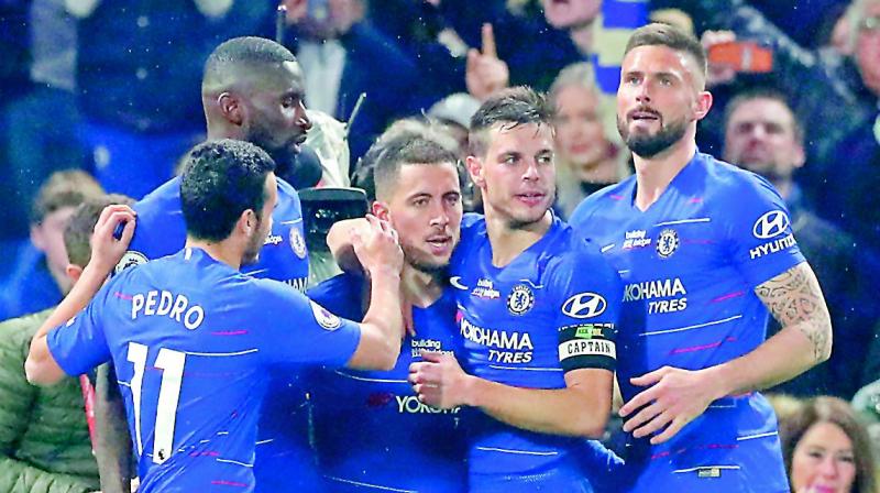 Chelsea’s Eden Hazard (centre) celebrates with teammates after scoring against West Ham in their EPL match at Stamford Bridge in London on Monday. (Photo: AP) Chelsea’s Eden Hazard (centre) celebrates with teammates after scoring against West Ham in their EPL match at Stamford Bridge in London on Monday. (Photo: AP)