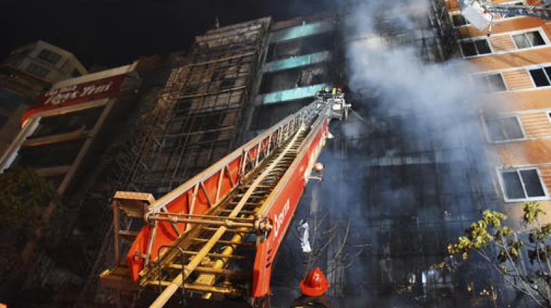 Firefighters extinguish a fire at a karaoke venue in Hanoi, Vietnam. (Photo: AP) Firefighters extinguish a fire at a karaoke venue in Hanoi, Vietnam. (Photo: AP)