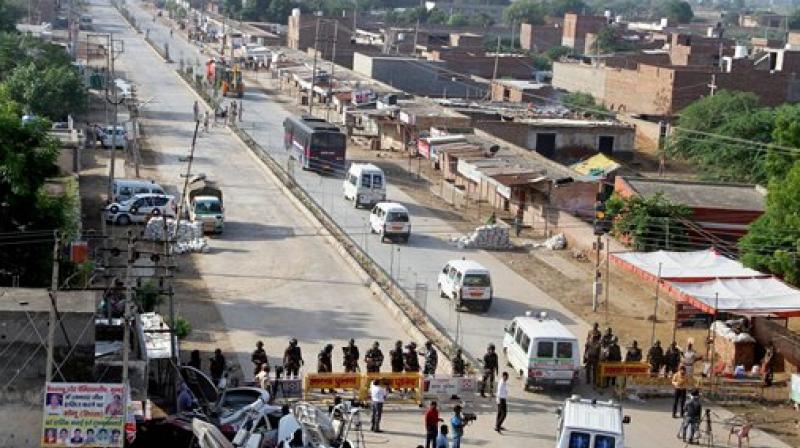Vehicles of the search team move towards Dera Sacha Sauda on the second day of the search operations inside the Dera headquarters in Sirsa on Saturday. (Photo: PTI) Vehicles of the search team move towards Dera Sacha Sauda on the second day of the search operations inside the Dera headquarters in Sirsa on Saturday. (Photo: PTI)