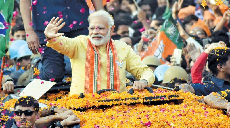 Prime Minister Narendra Modi at a road show in Varanasi during the Uttar Pradesh Assembly election campaign. (Photo: PTI) Prime Minister Narendra Modi at a road show in Varanasi during the Uttar Pradesh Assembly election campaign. (Photo: PTI)