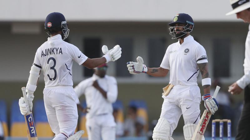 Virat Kohli and Ajinkya Rahane's half centuries strengthened India's position in the first Test against West Indies, the two performing their leadership duties with aplomb here. (Photo:AP) Virat Kohli and Ajinkya Rahane's half centuries strengthened India's position in the first Test against West Indies, the two performing their leadership duties with aplomb here. (Photo:AP)