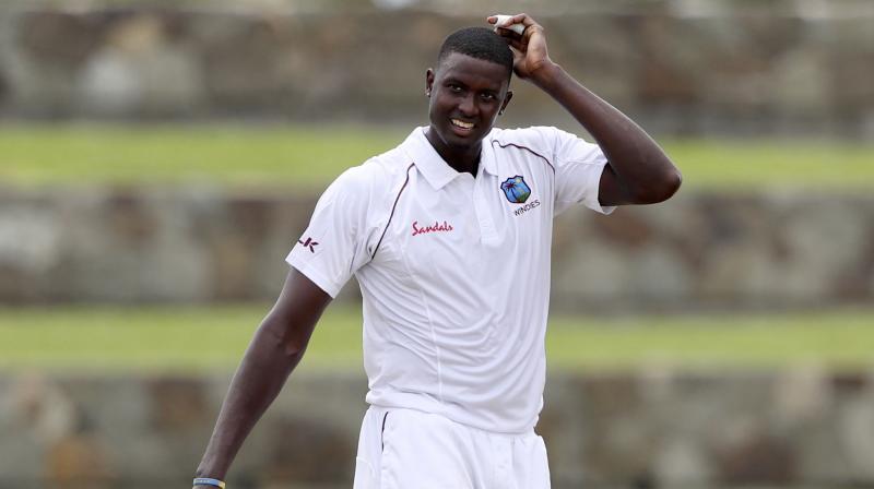 After getting bowled out for 222 in the first innings against India on day three of the first Test match, West Indies skipper Jason Holder expressed disappointment with the top-order, saying the batsmen failed to step up. (Photo:AP) After getting bowled out for 222 in the first innings against India on day three of the first Test match, West Indies skipper Jason Holder expressed disappointment with the top-order, saying the batsmen failed to step up. (Photo:AP)