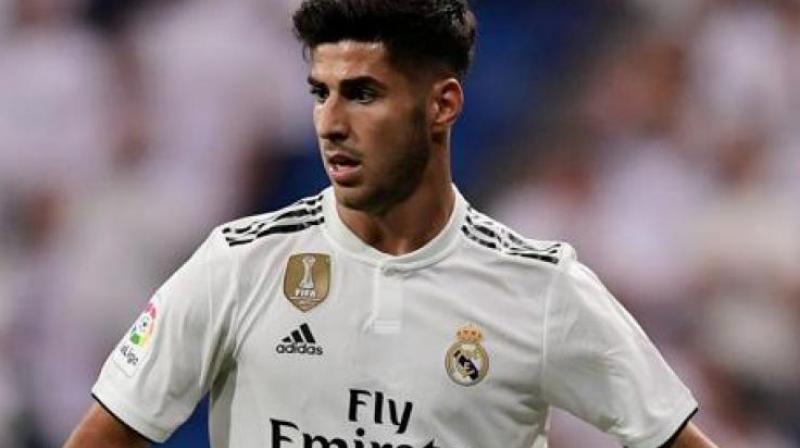 Asensio suffered a knee injury in the team's match against Arsenal in the International Champions Cup and the player is likely to miss six to nine months of footballing action. (Photo: AFP) Asensio suffered a knee injury in the team's match against Arsenal in the International Champions Cup and the player is likely to miss six to nine months of footballing action. (Photo: AFP)