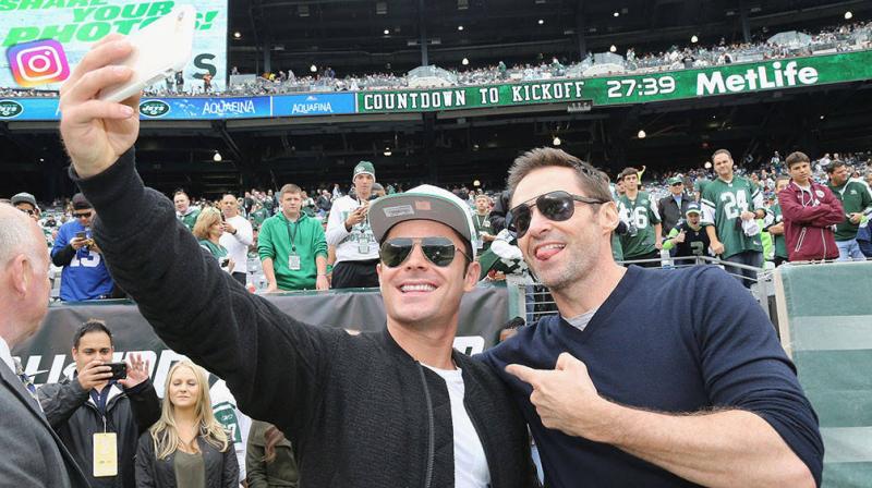 Zac Efron and Hugh Jackman. Zac Efron and Hugh Jackman.