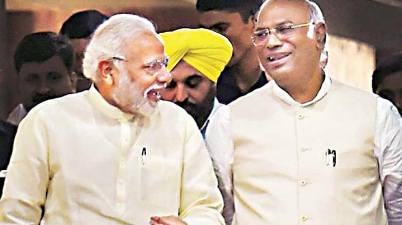 In this file photo, Congress leader in Lok Sabha Mallikarjun Kharge and PM Narendra Modi share a light moment In this file photo, Congress leader in Lok Sabha Mallikarjun Kharge and PM Narendra Modi share a light moment