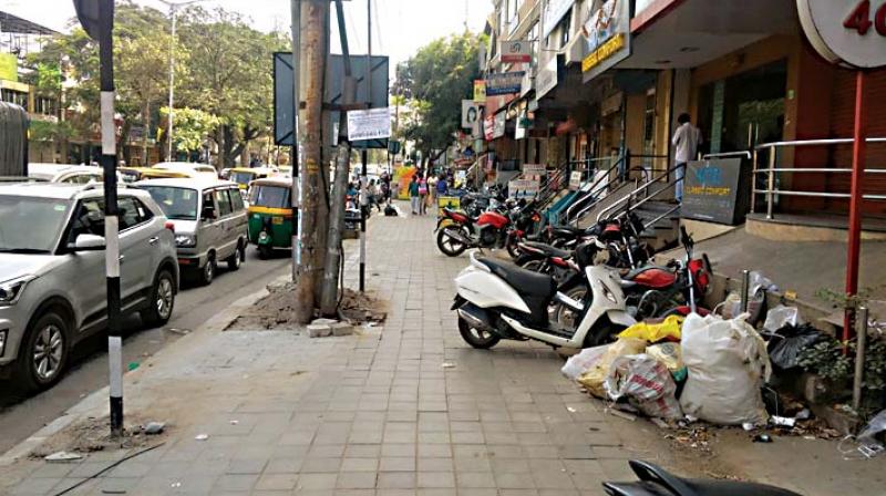 Two-wheelers parked on a footpath at Sarakki. Two-wheelers parked on a footpath at Sarakki.
