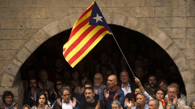 Spanish flags have been tied to balconies and windows around the city by pro-unity supporters on the nationwide holiday. Spanish flags have been tied to balconies and windows around the city by pro-unity supporters on the nationwide holiday.