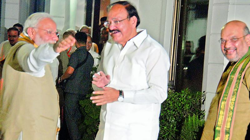 Prime Minister Narendra Modi with Venkaiah Naidu and BJP president Amit Shah in New Delhi on Monday. (Photo: DC) Prime Minister Narendra Modi with Venkaiah Naidu and BJP president Amit Shah in New Delhi on Monday. (Photo: DC)