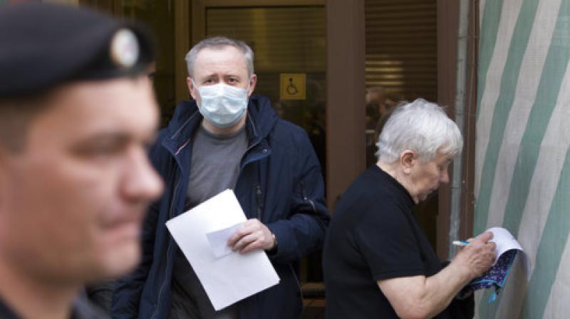 People holding letters enter the presidential administration office during a protest in downtown Moscow. (Photo: AP) People holding letters enter the presidential administration office during a protest in downtown Moscow. (Photo: AP)