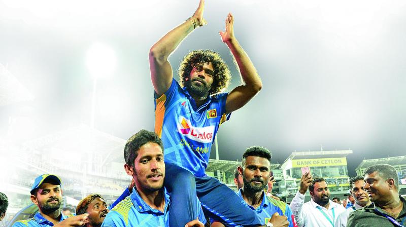 Sri Lankan players shoulder Lasith Malinga as he bids farewell in Colombo on Friday. (Photo: AFP) Sri Lankan players shoulder Lasith Malinga as he bids farewell in Colombo on Friday. (Photo: AFP)