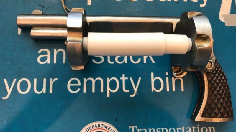 The realistic replica gun was designed to spin paper instead of bullets. (Photo: AP)