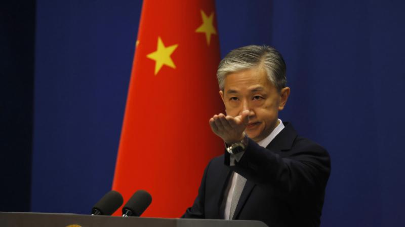 Foreign Ministry spokesperson Wang Wenbin gestures for questions during the daily briefing in Beijing on Thursday, July 23, 2020. China said \malicious slander\ is behind an order by the U.S. government to close its consulate in Houston, Texas, and maintained Thursday that its officials have never operated outside ordinary diplomatic norms. (AP)