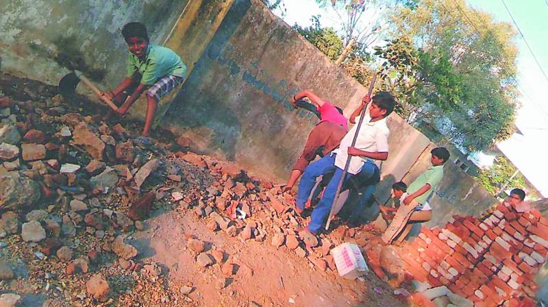 A photograph shows the students working near the compound of the Zilla Parishad High School at Shivrampally in Ranga Reddy district A photograph shows the students working near the compound of the Zilla Parishad High School at Shivrampally in Ranga Reddy district