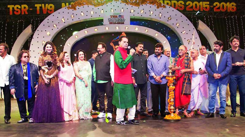 Congress MP T. Subbarami Reddy speaks at the TSR-TV9 awards show at Visakhapatnam in the presence of actor Manchu Lakshmi (from left), filmmaker-actor Mohan Babu, music director Bappi Lahiri, actors Madhu Shalini, Jaya Prada, Hema Malini, Krishnam Raju, AP minister Ganta Srinivasa Rao, actor-MP Chiranjeevi, Sarada Peetham seer Swaroopanandendra Saraswati actor-MLA Balakrishna and actor Meena. D. Venkatesh was best actor and Shreya best actress for Gopala Gopala, among others Congress MP T. Subbarami Reddy speaks at the TSR-TV9 awards show at Visakhapatnam in the presence of actor Manchu Lakshmi (from left), filmmaker-actor Mohan Babu, music director Bappi Lahiri, actors Madhu Shalini, Jaya Prada, Hema Malini, Krishnam Raju, AP minister Ganta Srinivasa Rao, actor-MP Chiranjeevi, Sarada Peetham seer Swaroopanandendra Saraswati actor-MLA Balakrishna and actor Meena. D. Venkatesh was best actor and Shreya best actress for Gopala Gopala, among others