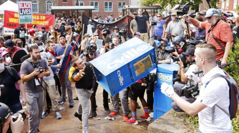 A woman was killed and 19 were injured when a car ploughed into a crowd of counter-protesters in Charlottesville. (Photo: AP) A woman was killed and 19 were injured when a car ploughed into a crowd of counter-protesters in Charlottesville. (Photo: AP)
