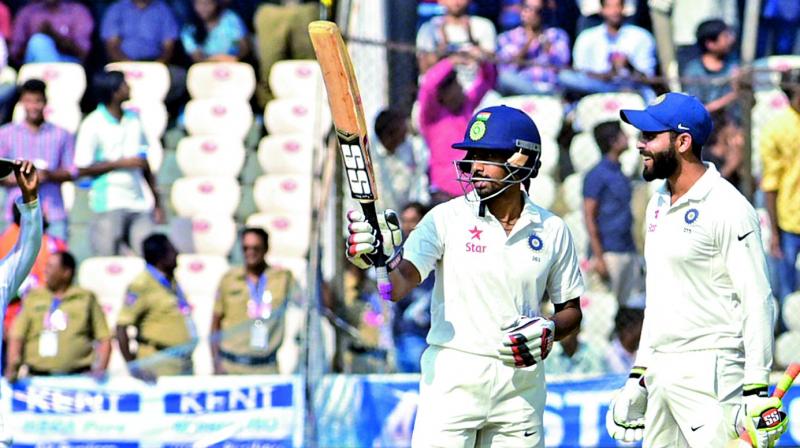 Wriddhiman Saha acknowledges cheers after scoring a century on the second day of the Test against Bangladesh on Friday. (Phtoo: DC) Wriddhiman Saha acknowledges cheers after scoring a century on the second day of the Test against Bangladesh on Friday. (Phtoo: DC)