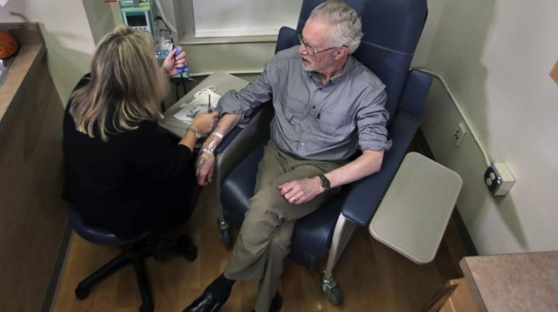 Those with a gene that raises their risk of the disease were started on a lower dose because they are more likely to suffer inflammation in the brain from medicines that target plaque. (Photo: AP) Those with a gene that raises their risk of the disease were started on a lower dose because they are more likely to suffer inflammation in the brain from medicines that target plaque. (Photo: AP)