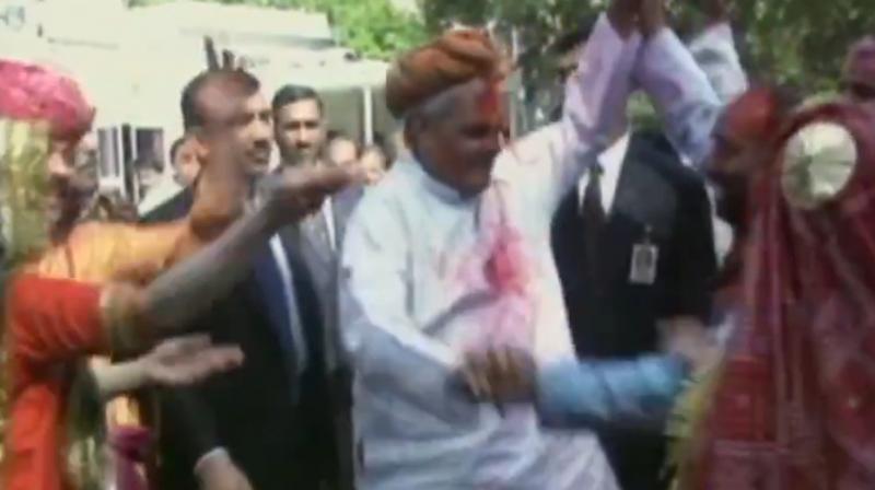 Surrounded by professional folk dancers, Atal Bihari Vajpayee could be seen smeared in colours displays his dancing skills winning a million hearts. (ANI screengrab) Surrounded by professional folk dancers, Atal Bihari Vajpayee could be seen smeared in colours displays his dancing skills winning a million hearts. (ANI screengrab)