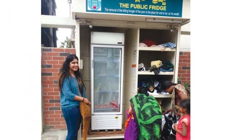A community fridge stacked with food. A community fridge stacked with food.