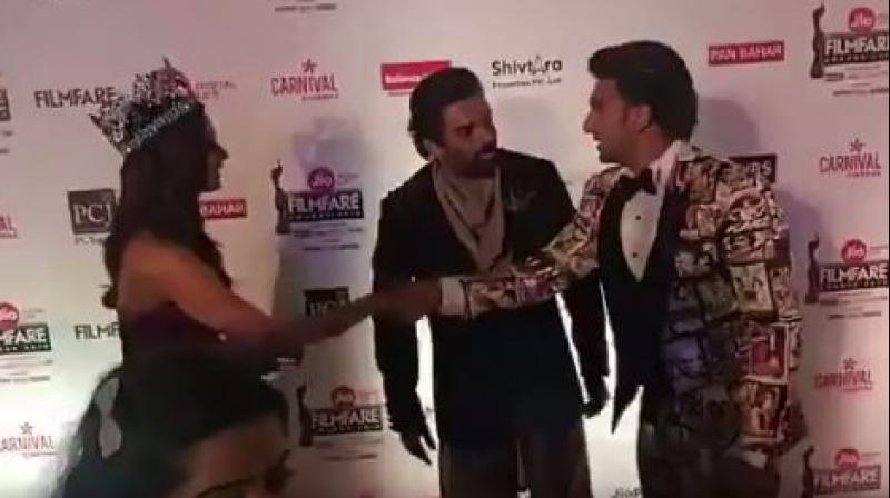 Screenshot of Ranveer Singh with R. Madhavan and Manushi Chhillar at an awards show. Screenshot of Ranveer Singh with R. Madhavan and Manushi Chhillar at an awards show.