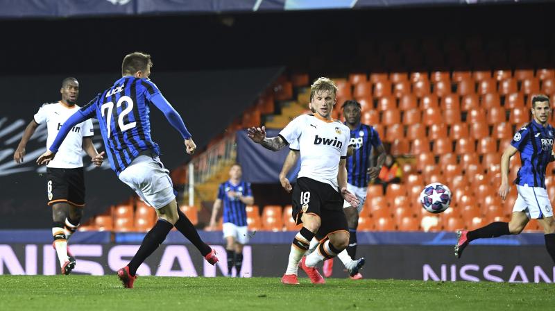 Atalantas Josip Ilicic scores his sides fourth goal during the Champions League round of 16 second leg soccer match between Valencia and Atalanta in Valencia, Spain, Tuesday March 10, 2020. The match is being in an empty stadium because of the coronavirus outbreak. (UEFA via AP)