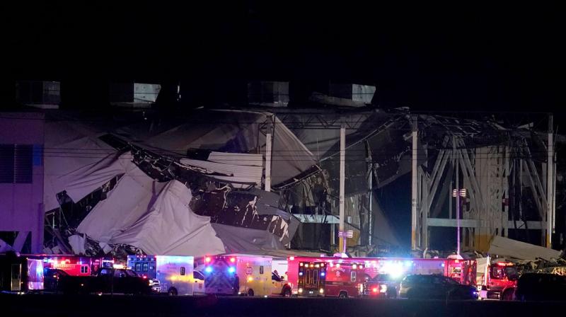 At least 100 emergency vehicles descended upon the Amazon warehouse near Edwardsville, Illinois, about 25 miles (40 kilometres) east of St. Louis, where a wall that was about the length of a football field collapsed, as did the roof above it. (AP Photo)