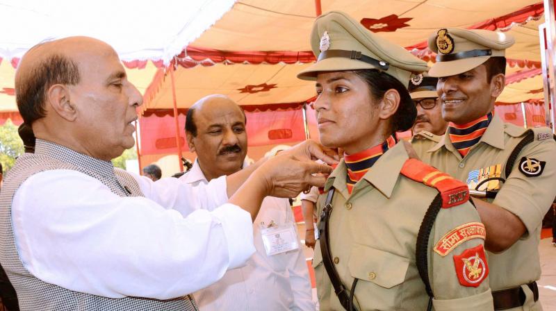 Union Home Minister Rajnath Singh pinning stars on the shoulders of a cadet during passing out parade at Border Security Force (BSF) Academy, Tekanpur, Gwalior. (Photo: PTI) Union Home Minister Rajnath Singh pinning stars on the shoulders of a cadet during passing out parade at Border Security Force (BSF) Academy, Tekanpur, Gwalior. (Photo: PTI)