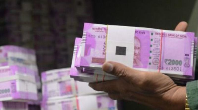 The success in divestments and encouraging goods and services tax collections will help government reduce pressure on the fiscal math, says a report. (Photo: AFP/Representational) The success in divestments and encouraging goods and services tax collections will help government reduce pressure on the fiscal math, says a report. (Photo: AFP/Representational)