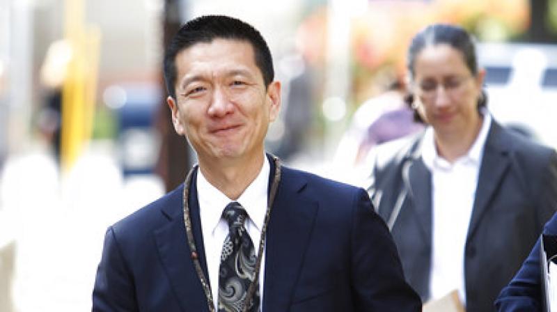 Hawaii Attorney General Douglas Chin flashes a Hawaii shaka before entering federal court. (Photo: AP) Hawaii Attorney General Douglas Chin flashes a Hawaii shaka before entering federal court. (Photo: AP)