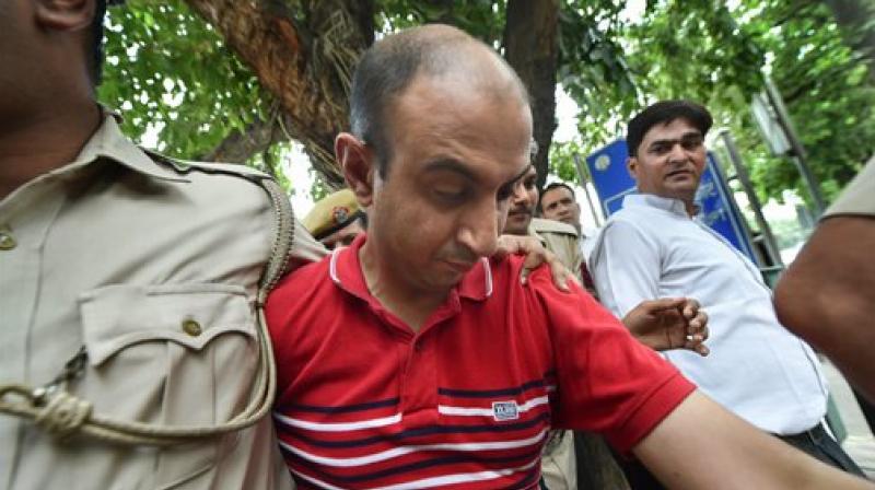 Accused Army Major Nikhil Rai Handa being taken by police to be produced at Patiala Court, after his arrest in relation with the alleged murder of a fellow army Major's wife. (Photo: PTI) Accused Army Major Nikhil Rai Handa being taken by police to be produced at Patiala Court, after his arrest in relation with the alleged murder of a fellow army Major's wife. (Photo: PTI)