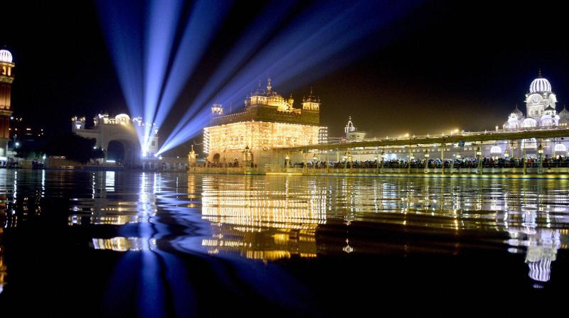 Illuminated Golden Temple on the occasion of 350th birth anniversary of Guru Gobind Singh Ji in Amritsar on Wednesday. (Photo: PTI) Illuminated Golden Temple on the occasion of 350th birth anniversary of Guru Gobind Singh Ji in Amritsar on Wednesday. (Photo: PTI)