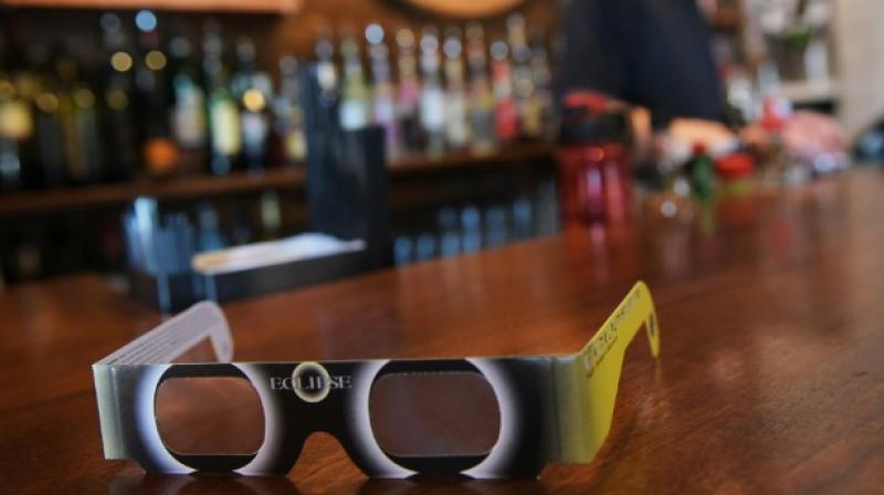 A pair of solar eclipse glasses are seen for sale at a restaurant ahead of the total solar eclipse in Charleston, South Carolina, on August 20, 2017. (Photo: AFP) A pair of solar eclipse glasses are seen for sale at a restaurant ahead of the total solar eclipse in Charleston, South Carolina, on August 20, 2017. (Photo: AFP)