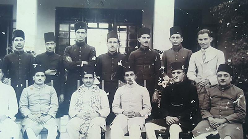 The writer’s father (standing third from left) who joined the Hyderabad Revenue Service in the early 1930s had to perforce wear a sherwani and fez for all official functions. (Photo: File photo) The writer’s father (standing third from left) who joined the Hyderabad Revenue Service in the early 1930s had to perforce wear a sherwani and fez for all official functions. (Photo: File photo)