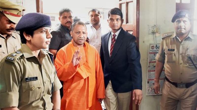 UP Chief Minister Yogi Adityanath during a surprise visit at the Hazratganj police station in Lucknow on Thursday. (Photo: PTI) UP Chief Minister Yogi Adityanath during a surprise visit at the Hazratganj police station in Lucknow on Thursday. (Photo: PTI)