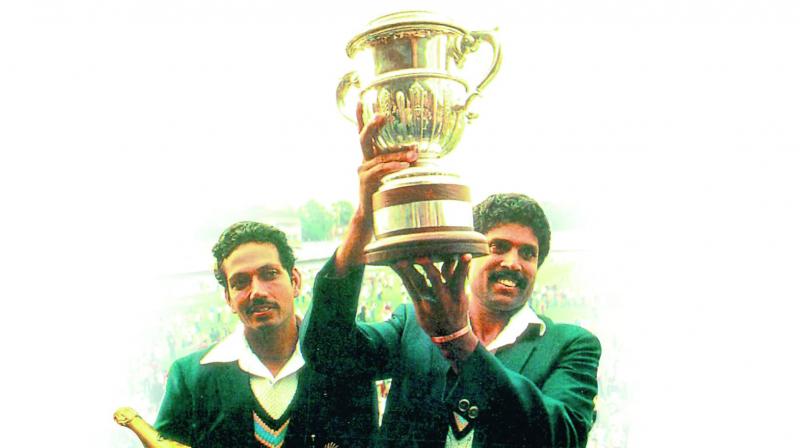 India skipper Kapil Dev holds the World Cup aloft as Mohinder Amarnath looks on. India skipper Kapil Dev holds the World Cup aloft as Mohinder Amarnath looks on.