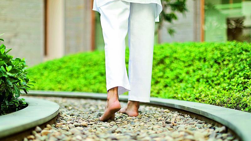 Walking barefoot on pebbles helps heal different organs and body systems. Walking barefoot on pebbles helps heal different organs and body systems.