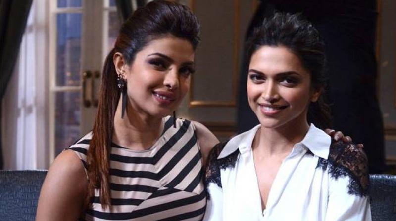 Priyanka snapped with Deepika on Karan's show. Priyanka snapped with Deepika on Karan's show.