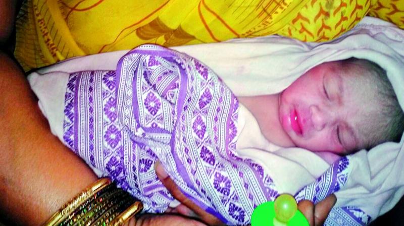The newborn girl child who was found inside a parked auto at Pasra village in Govindaraopet mandal of Jayashankar Bhupalapalli district. The newborn girl child who was found inside a parked auto at Pasra village in Govindaraopet mandal of Jayashankar Bhupalapalli district.