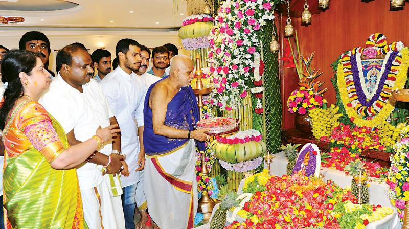 JD(S) state president H.D. Kumaraswamy and wife Anitha conduct a pooja at the opening of their renovated house in JP Nagar in Bengaluru on Wednesday JD(S) state president H.D. Kumaraswamy and wife Anitha conduct a pooja at the opening of their renovated house in JP Nagar in Bengaluru on Wednesday